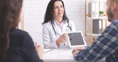 doctor-showing-test-results-on-digital-tablet-to-m-2022-12-16-07-35-31-utc1.webp