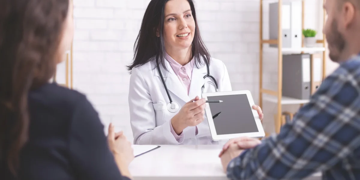 doctor-showing-test-results-on-digital-tablet-to-m-2022-12-16-07-35-31-utc1.webp